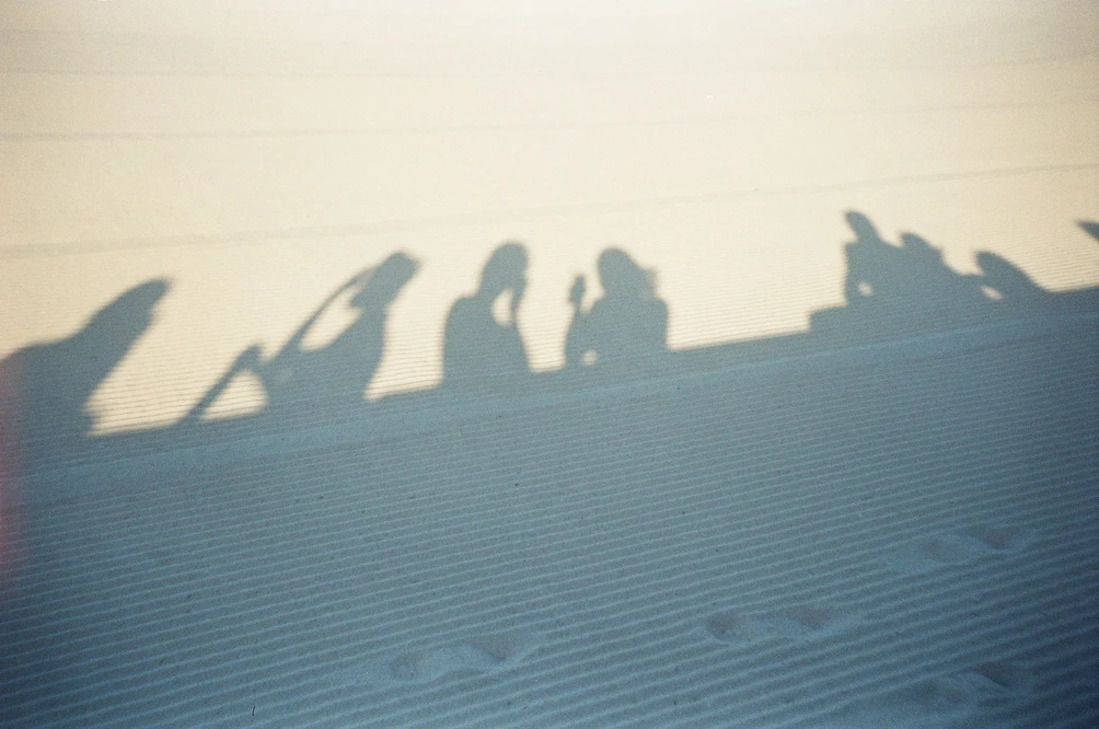 Shadow Silhouettes on Sandy Beach. Shot with Olympus Mju II, Kodal Gold 200 film