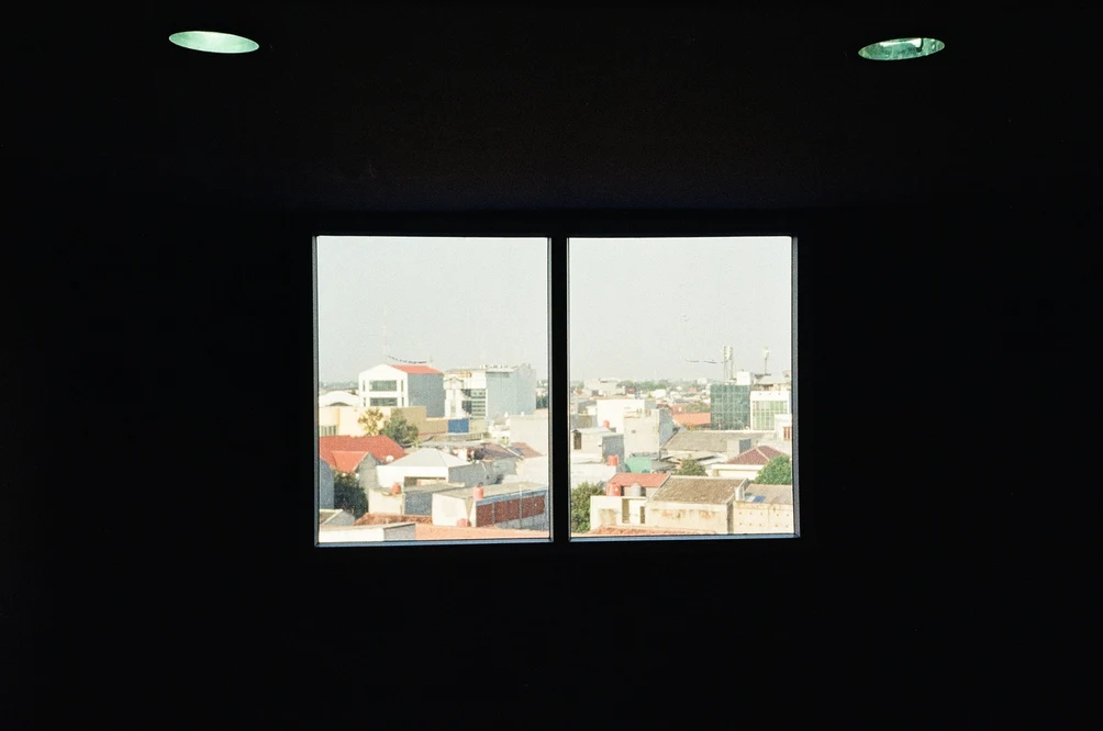 Cityscape Framed Through a Window. Shot with Olympus Mju II, Kodak Ultramax 400 film