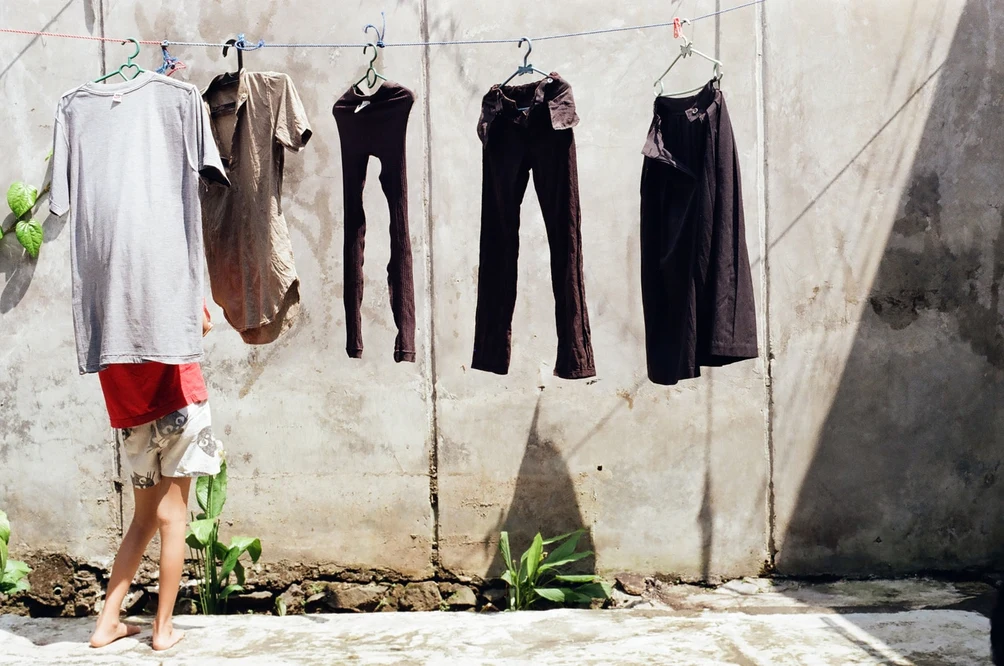 Hanging Laundry in Morning Sunlight. Shot with Olympus OM-1, Kodal Gold 200 film