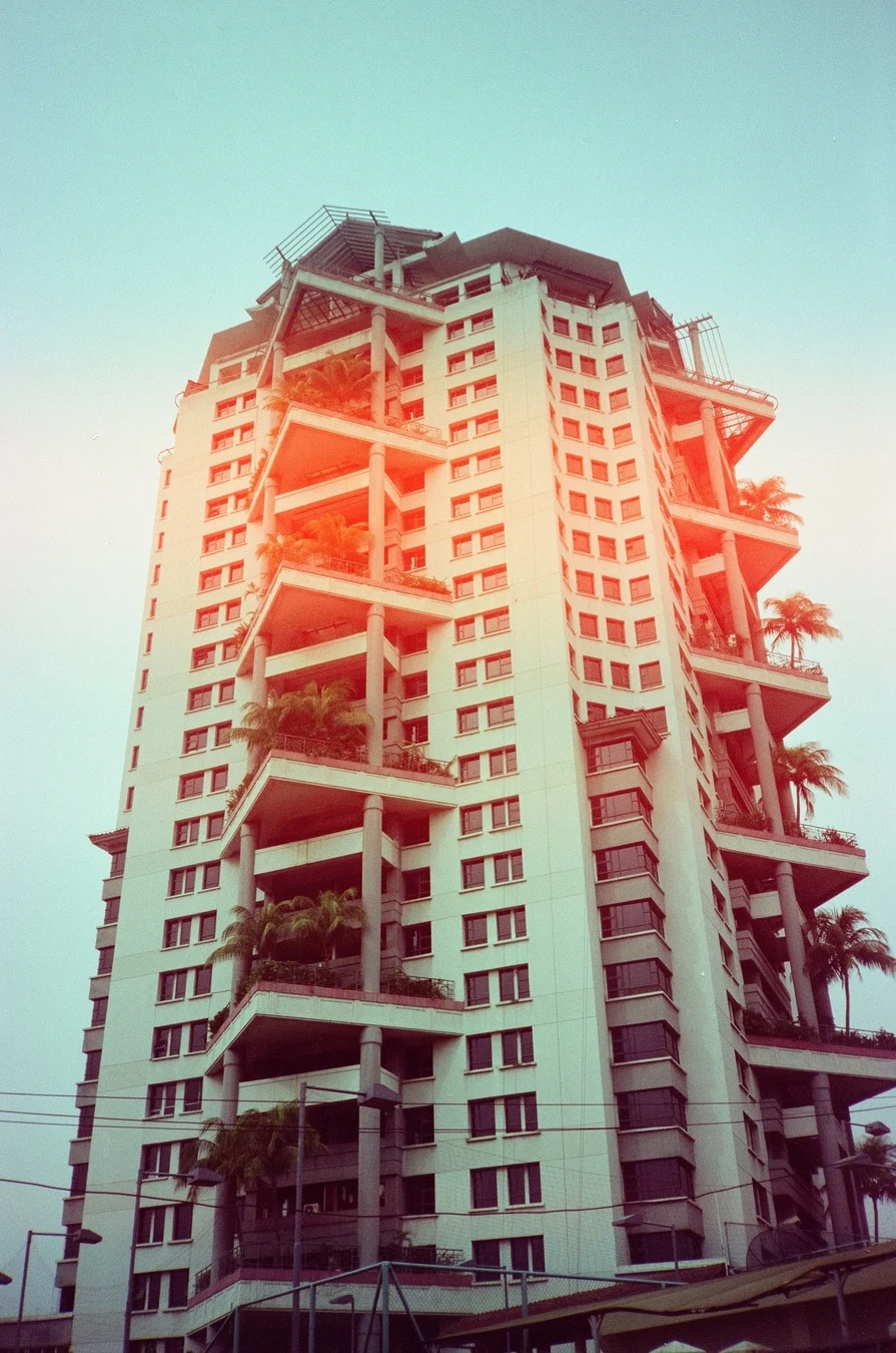 Tropical Tower Under Hazy Sky. Shot with Olympus XA-1, Cartenz 200 film
