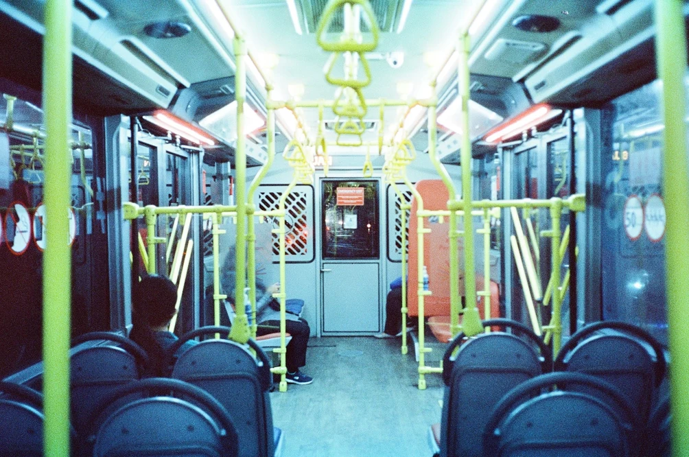 Quiet Night on the City Train. Shot with Olympus Mju II, Cinestill 800T film