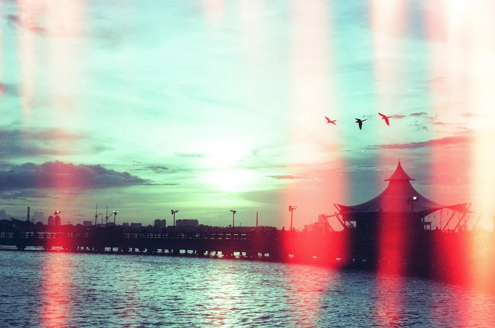 Sunset at Ancol Waterfront with Film Light Leaks. Shot with Olympus OM-1, Cartenz 200 film